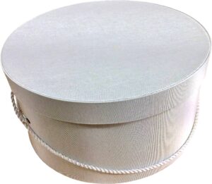 191-Ivory bengaline hatbox with a cream cording handle.