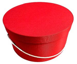 261-A beautiful antique coral hatbox with a cream cording handle.