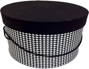 11-Black and white houndstooth check hatbox with a black lid and black cording handle.