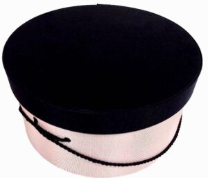 262-A pastel pink hatbox with a solid black lid and black cording handle.