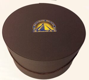 179AB Adventurebilt brown fabric hatbox with a brown cording handle and a hat insert.