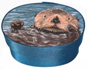 Otter artwork on a blue fabric box.